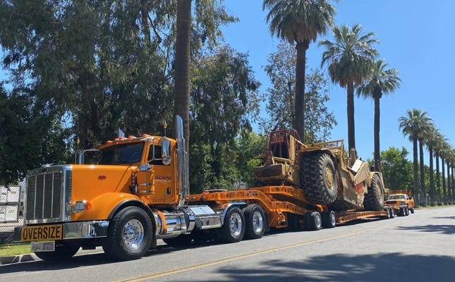 jacinto lowbed truck along palms